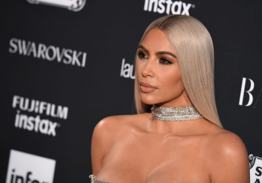 Why did Kim Kardashian use a surrogate?