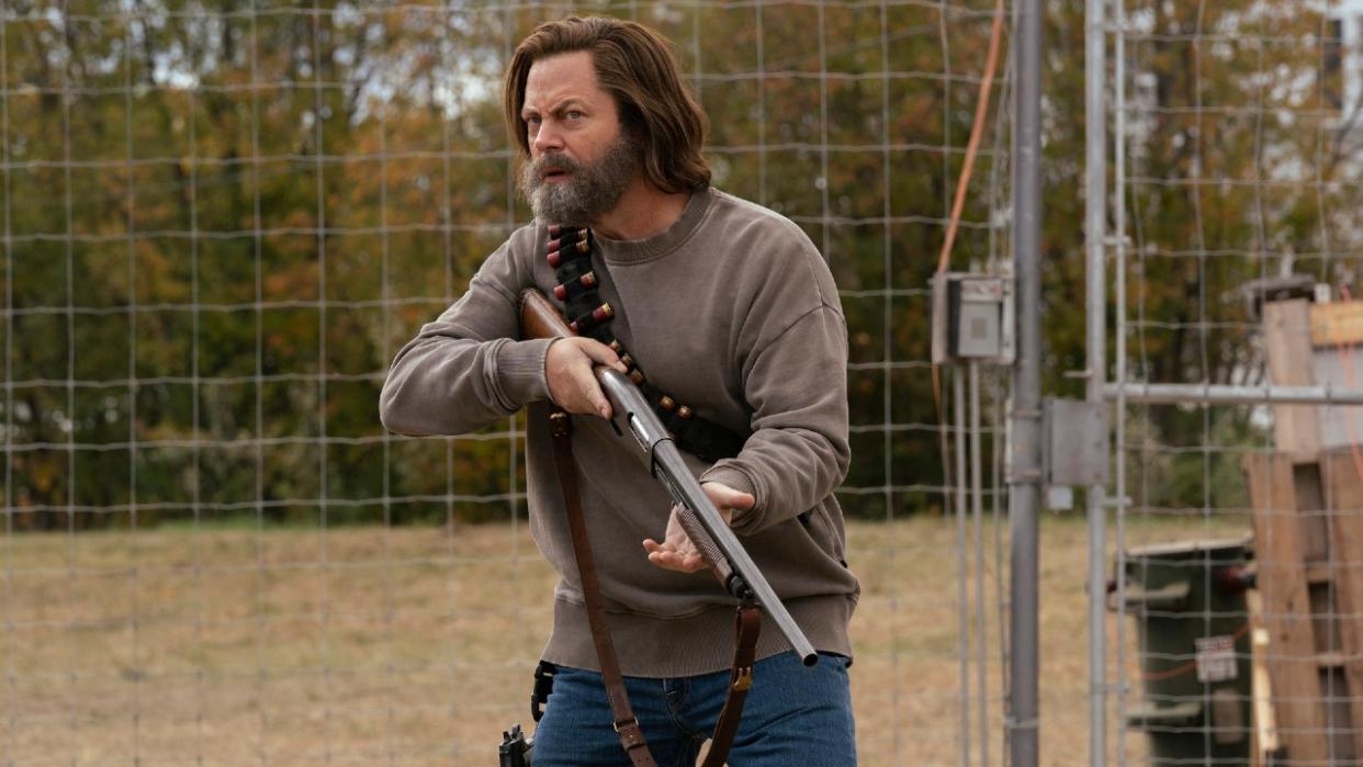  Nick Offerman as Bill on The Las of Us holding a shotgun 