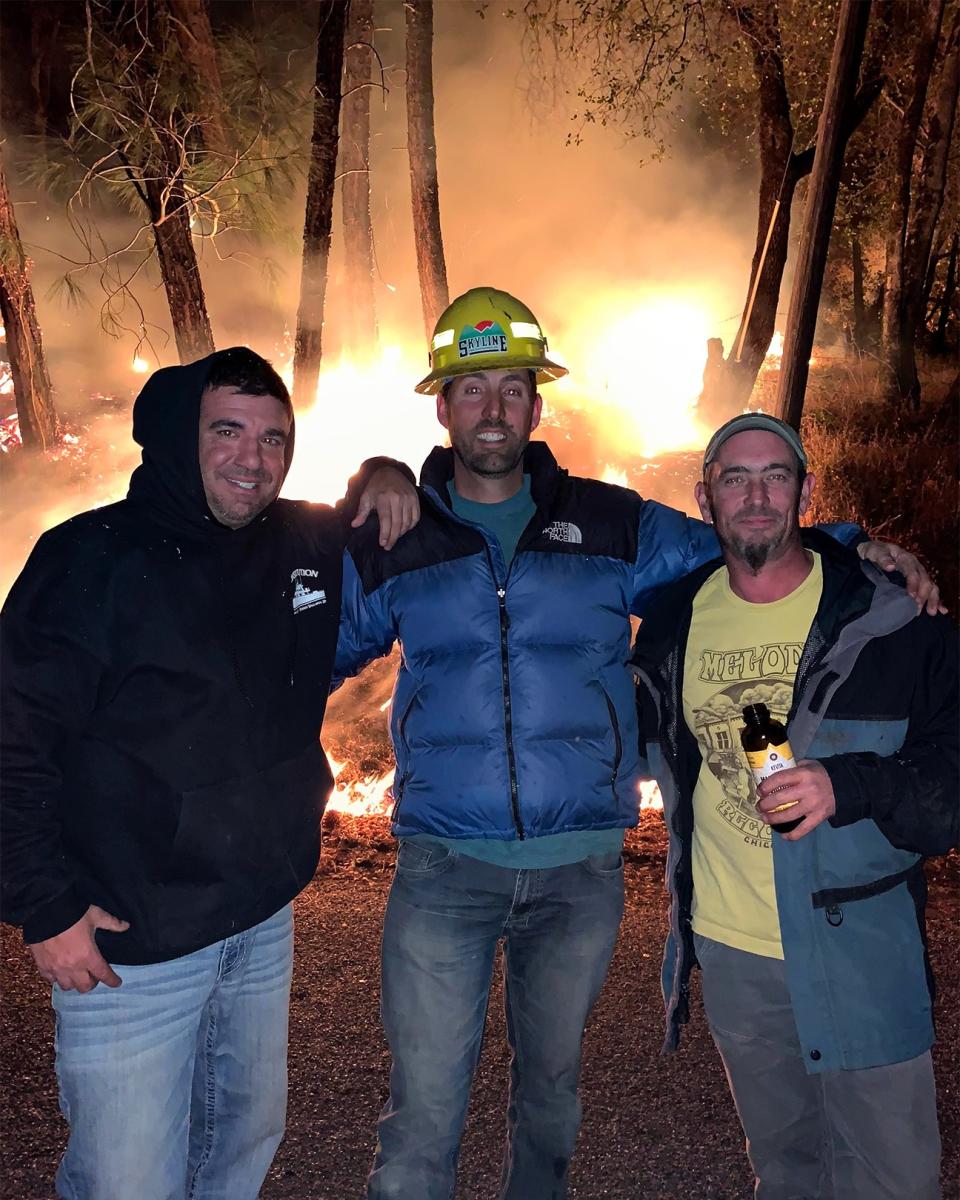 Exhausted but undaunted, Dharma LaRocca, Jason McCord, and Jeb Sisk pose for a photo that was later shared widely among those who'd evacuated the canyon—and were cheering their friends from afar.