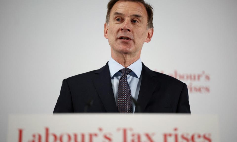 <span>Jeremy Hunt delivering his speech on economy and taxes in London.</span><span>Photograph: Henry Nicholls/AFP/Getty Images</span>