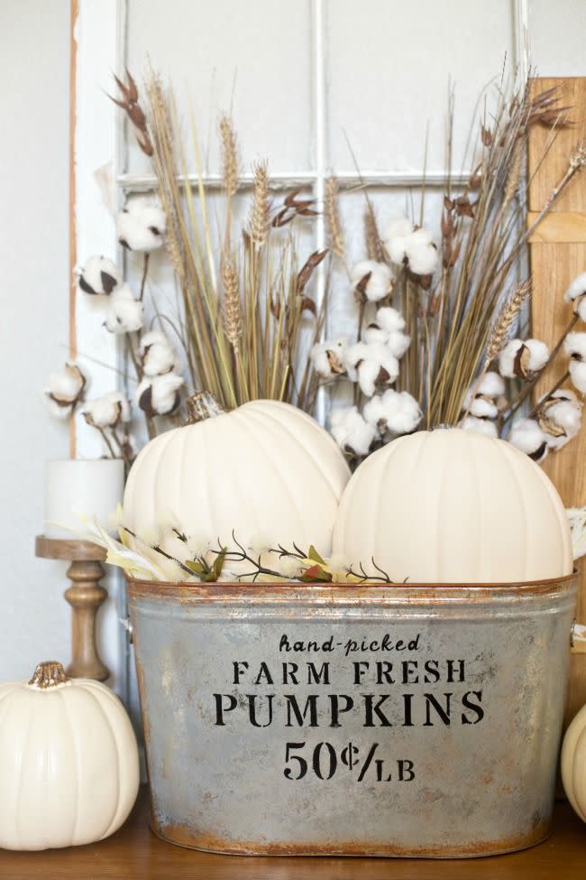 <p>No need to buy real pumpkins for this craft—just pick up a few faux ones at the craft store along with some other supplies, and you can assemble yourself a country entryway decoration in no time.</p><p><strong>Get the tutorial at <a href="http://www.anightowlblog.com/2016/09/diy-farmhouse-pumpkin-bucket.html/" rel="nofollow noopener" target="_blank" data-ylk="slk:A Night Owl;elm:context_link;itc:0;sec:content-canvas" class="link ">A Night Owl</a>.</strong></p>