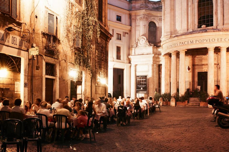 People dining outside Restaurants at dusk, Italy, Lazio,Rome