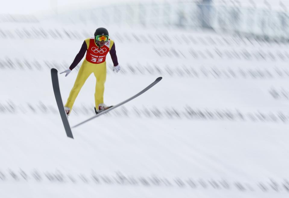 Bill Demong of the United States makes his jump during a men's Nordic combined, large hill, training session at the 2014 Winter Olympics, Monday, Feb. 17, 2014, in Krasnaya Polyana, Russia. (AP Photo/Dmitry Lovetsky)