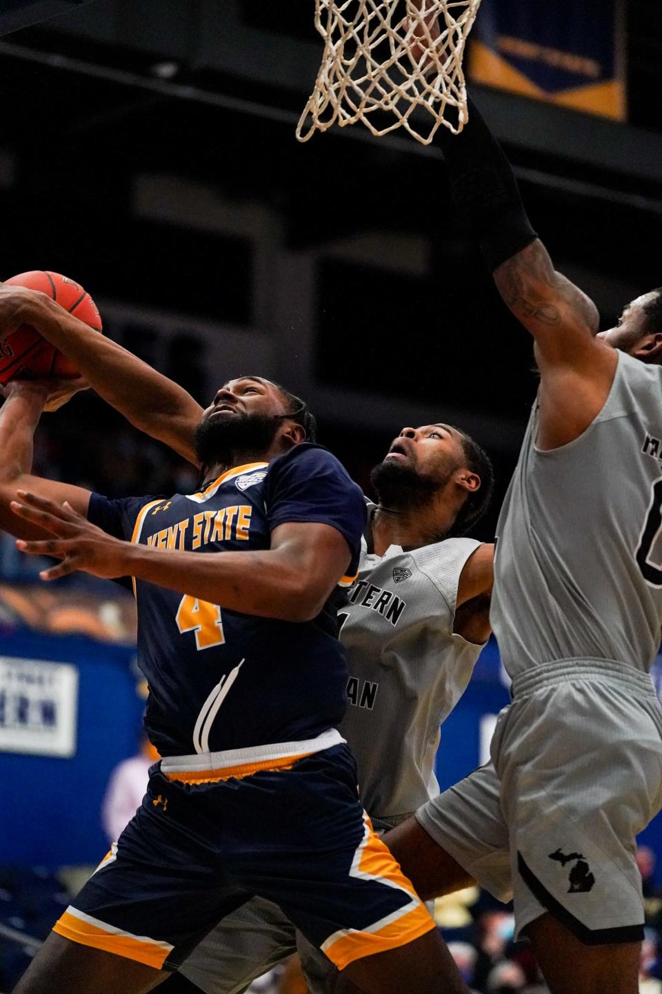 Kent State grad transfer guard Andrew Garcia gets fouled while attacking the basket against Western Michigan's defense on Tuesday at the M.A.C. Center.