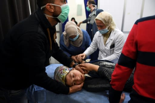 A Syrian girl receives treatment on November 24, 2018 at a hospital in Aleppo where the regime accused armed groups of carrying out a "toxic gas" attack