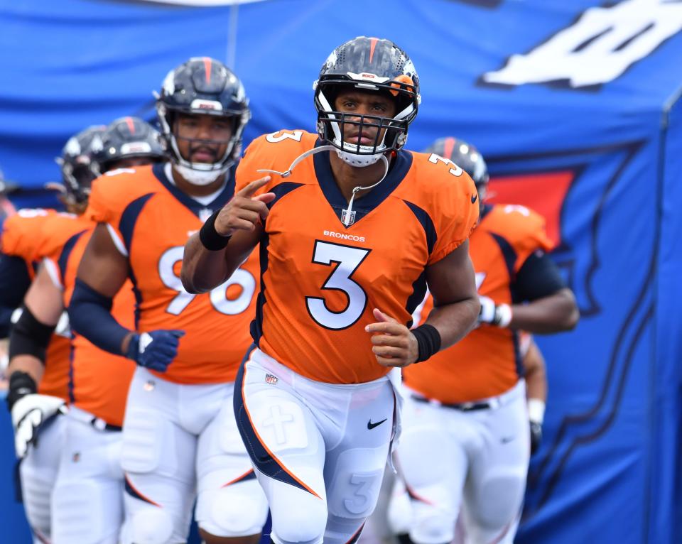 Denver Broncos quarterback Russell Wilson (3) leads his team onto the field before a pre-season game against the Buffalo Bills at Highmark Stadium.