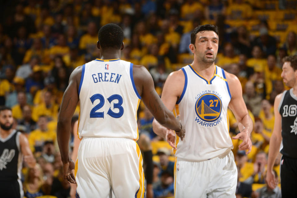 Zaza Pachulia high-fives Draymond Green during the first quarter of Game 2 against the San Antonio Spurs. (Noah Graham/NBAE/Getty Images)