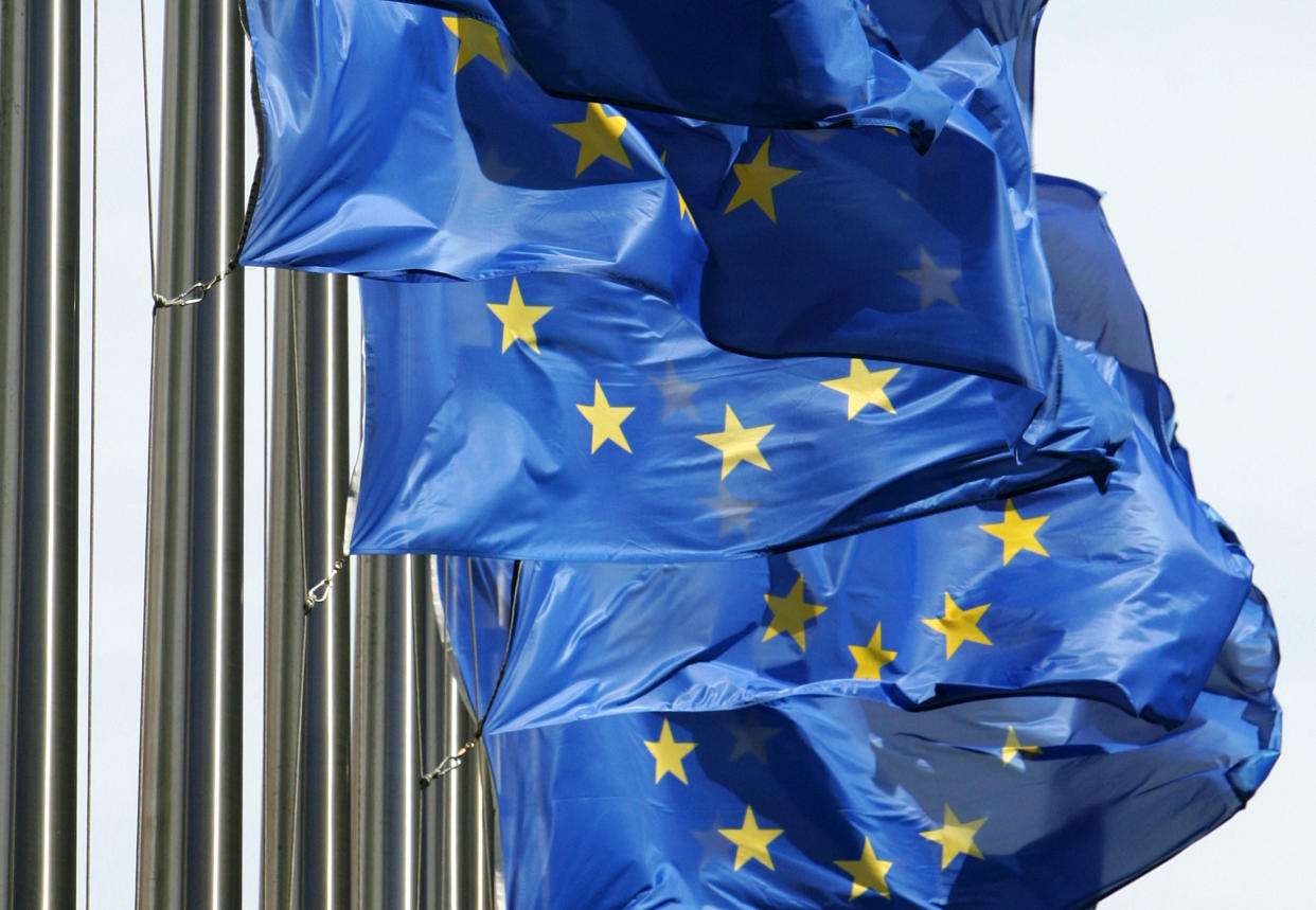 European Union flags fly outside the European Commission headquarters in Brussels June 15, 2005. The EU budget battle and salvaging the proposed constitution will top the summit agenda for the 25-nation bloc when it meets on June 16-17 at its Brussels headquarters. UNICS REUTERS/Thierry Roge  THR/CCK