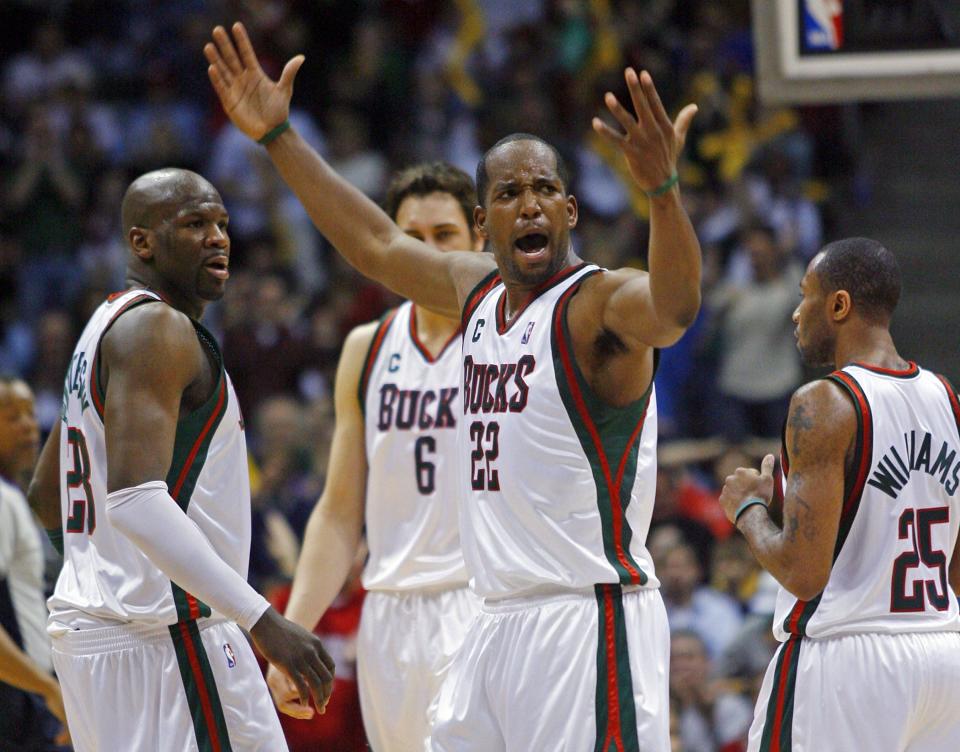 Milwaukee Bucks Michael Redd, center, reacts after hitting a 3-point basket against the Chicago Bulls in the second half of a basketball game Sunday, March 4, 2007, in Milwaukee. (AP Photo/Darren Hauck)