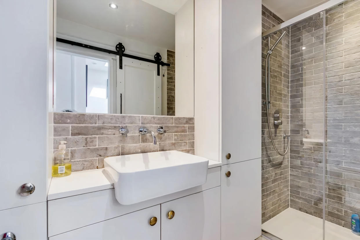 The renovated bathroom has a sliding door to save space. (Zoopla)