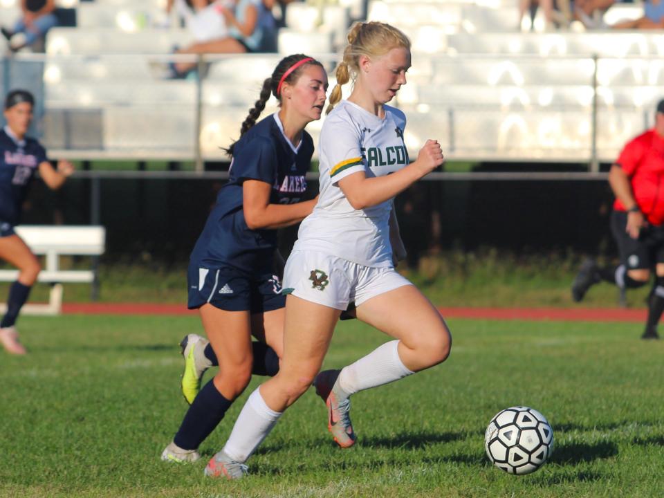 Dighton-Rehoboth's Cailee Leonard goes for goal pursued by Apponequet's Niamh Gallagher during a South Coast Conference match.