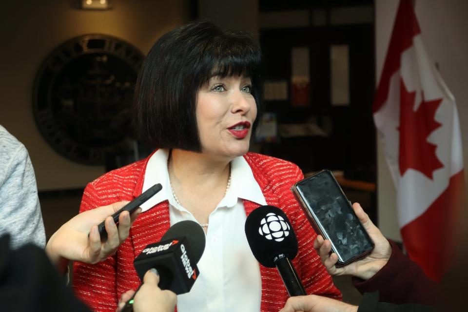 Ginette Petitpas Taylor, the MP for Moncton–Riverview–Dieppe, speaking to reporters after a federal funding news conference at Moncton city hall on Nov. 16, 2023.