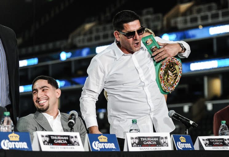 Angel Garcia (R) looks on next to his son, Danny, during Thursday's media conference. (Getty)