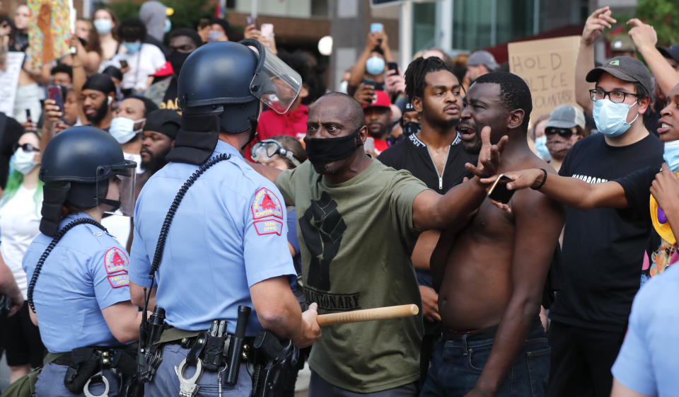 Demonstrators stand off with police in downtown Raleigh, N.C. Saturday, May 30, 2020, during a protest over the death of George Floyd, who died in police custody on Memorial Day in Minneapolis.(Ethan Hyman/The News & Observer via AP)