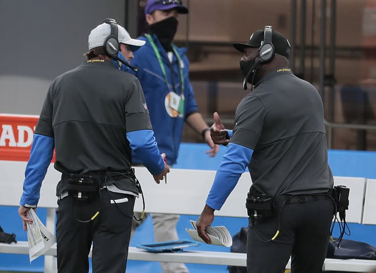 Inglewood, CA, Sunday, Dec. 13, 2020 Chargers coach Anthony Lynn, right, has a heated discussion.