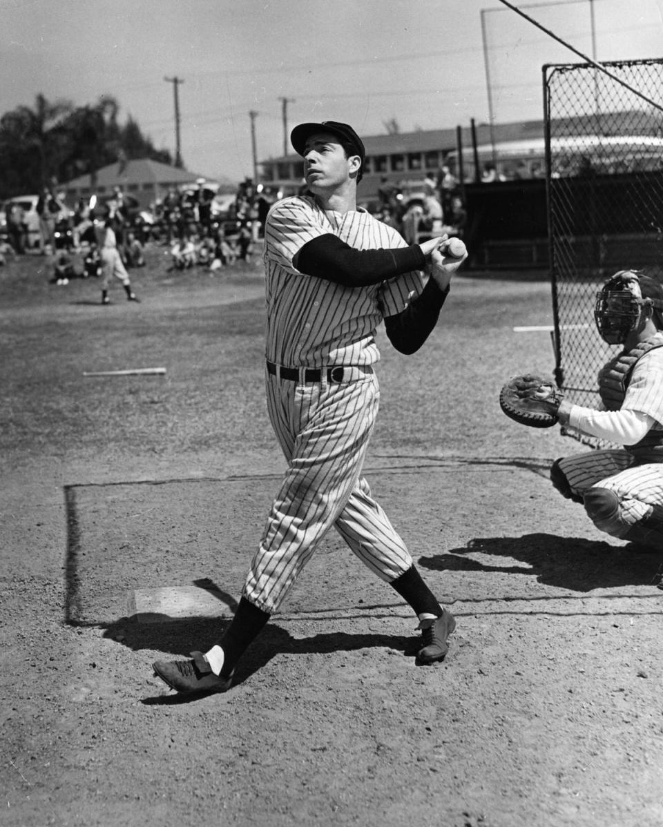 Joe DiMaggio in action in 1948. Giuliani owns a shirt once worn by the New York Yankees legend – although it might be a replica (Getty Images)