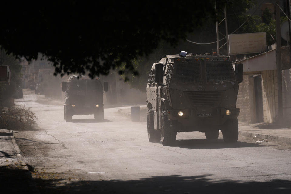Israeli military convoy enters the Palestinian refugee camp in Jenin, the West Bank, Thursday, Nov. 9, 2023l. (AP Photo/Majdi Mohammed)