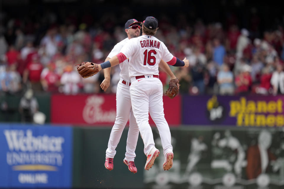 St. Louis Cardinals' Paul DeJong, left, and Nolan Gorman (16) celebrate a 5-1 victory over the New York Yankees in a baseball game Sunday, July 2, 2023, in St. Louis. (AP Photo/Jeff Roberson)