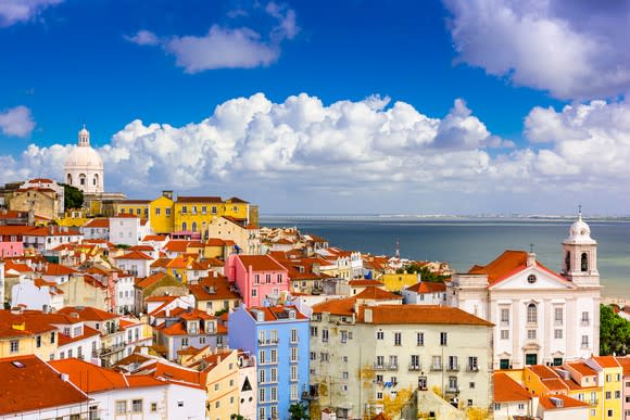 Lisbon, Portugal, cityscape, with pastel buildings and the sea