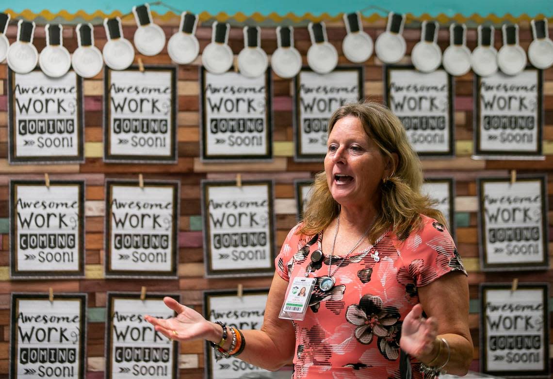 Broward County School Board Member Debra Hixon talks to a class of fifth graders during the first day of school at Tropical Elementary School on Tuesday, Aug. 16, 2022 in Plantation, Fla.