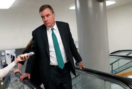 FILE PHOTO: U.S. Senator Mark Warner (D-VA) speaks with news media at the U.S. Capitol building in Washington, U.S., July 16, 2018. REUTERS/Leah Millis/File Photo