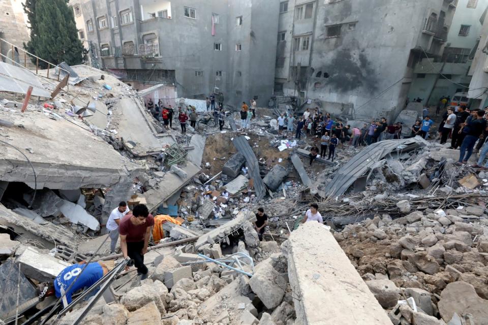 Palestinians search the destroyed annexe of the Greek Orthodox Saint Porphyrius Church after the strike in October (AFP/Getty)