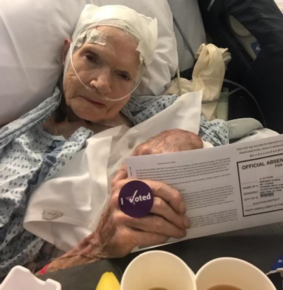 NYC nurses Lisa Schavrien and Erin Ainslie Smith help patients cast ballots from their bedside