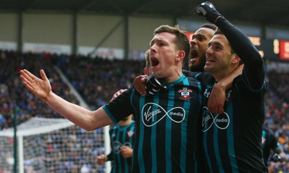 Southampton’s Pierre-Emile Højbjerg celebrates his goal with Dusan Tadic and Ryan Bertrand at DW Stadium on Sunday.