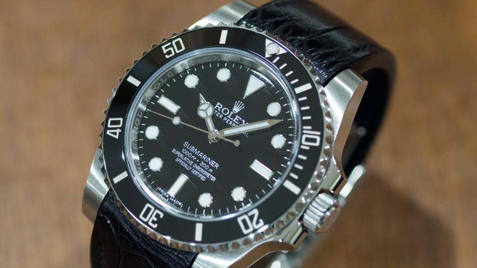 BANGKOK - MARCH 3 : Rolex submariner,with ceramic bezel and black dial, decorated with black alligator leather strap,selective focus at its brand name, was taken on March 6 ,2017, in Bangkok, Thailand.