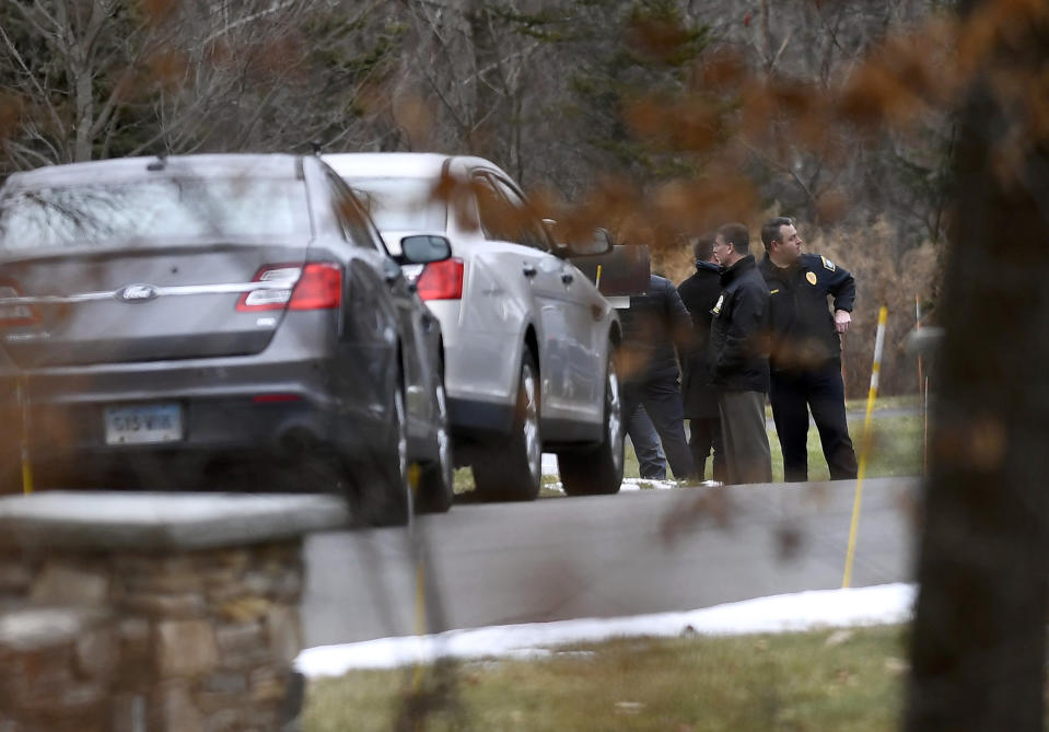 Police gather outside the driveway of Fotus Dulos, Tuesday, Jan. 28, 2020, in Farmington, Conn. A dispatcher from the Farmington police said officers had responded to Dulos' home and he was later transported to the hospital (AP Photo/Jessica Hill)