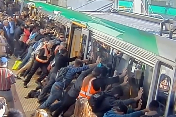 Perth commuters band together to push train off man who trapped leg in gap between carriage and platform (Getty)