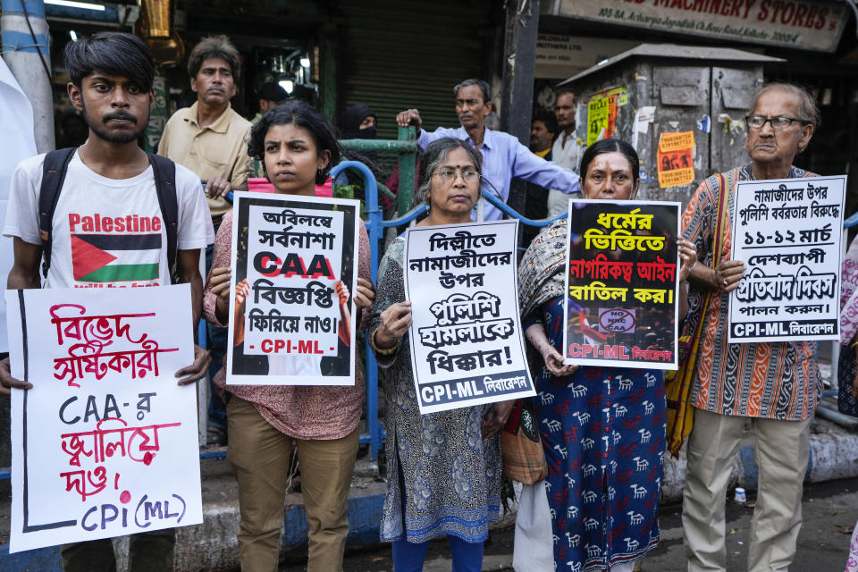 Activists and supporter of Communist Party of India (Marxist-Leninist) protest against the Citizenship Amendment Act (CAA), in Kolkata, India, Tuesday, March 12, 2024. India has implemented a controversial citizenship law that has been widely criticized for excluding Muslims, a minority community whose concerns have heightened under Prime Minister Narendra Modi's Hindu nationalist government. The act provides a fast track to naturalization for Hindus, Parsis, Sikhs, Buddhists, Jains and Christians who fled to Hindu-majority India from Afghanistan, Bangladesh and Pakistan before Dec. 31, 2014. (AP Photo/Bikas Das)