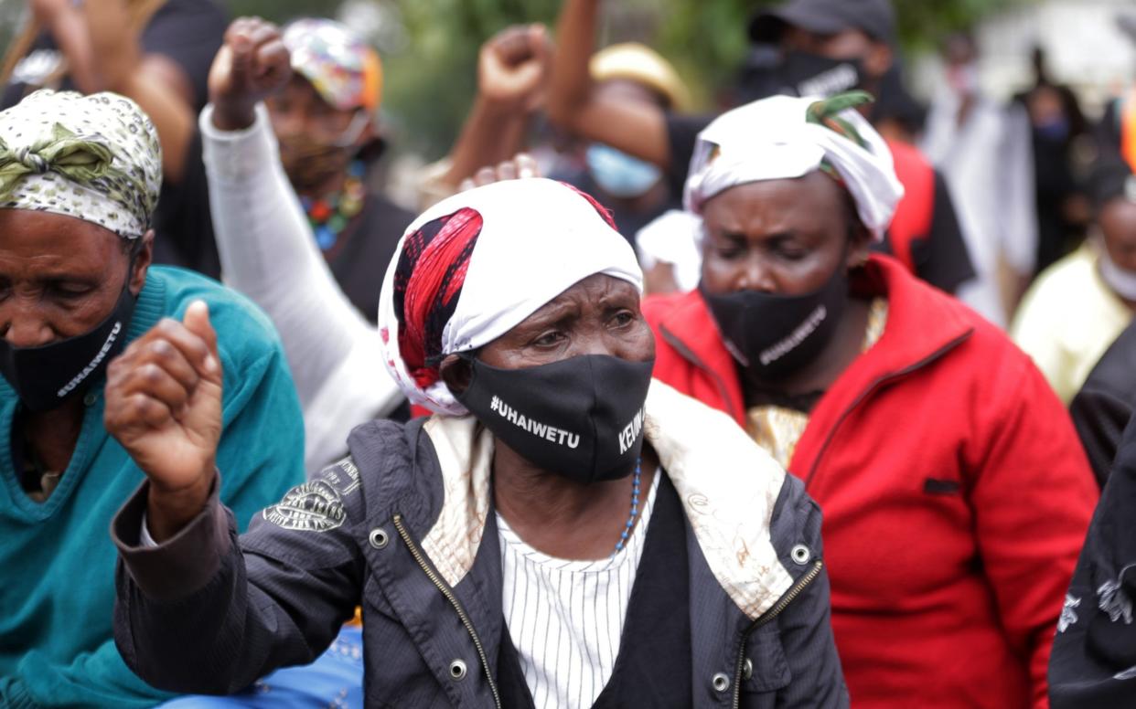 Kenyans demonstrate in front of parliament last June over the killing of civilians who broke lockdown restrictions - Billy Mutai/Anadolu Agency