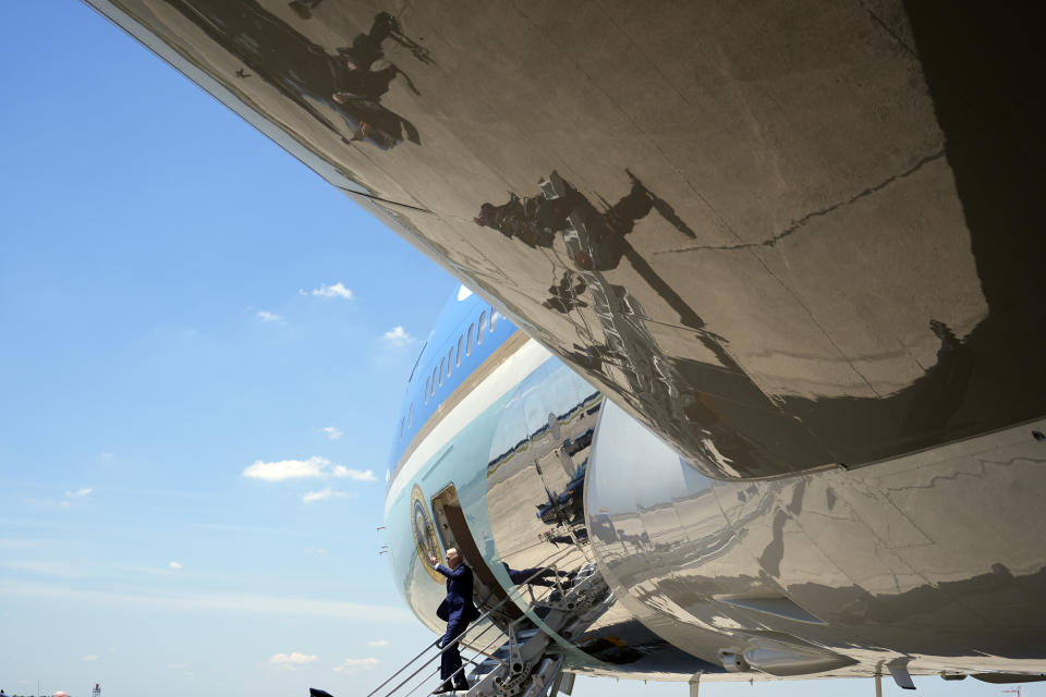 President Joe Biden waves as he arrives on Air Force One at Charlotte Douglas International Airport, Thursday, May 2, 2024, in Charlotte, N.C. Biden met with the families of law enforcement officers shot to death on the job. (AP Photo/Alex Brandon)