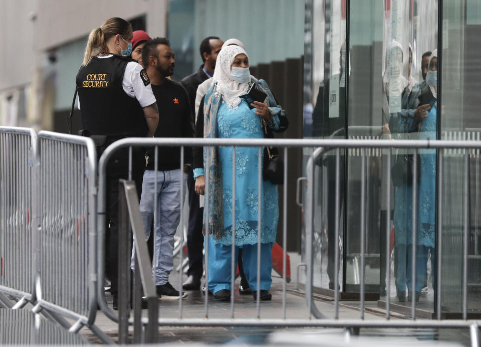 Family and survivors from the March 2019 Christchurch mosque shootings arrive outside the Christchurch High Court for the sentencing of twenty-nine-year-old Australian Brenton Harrison Tarrant, in Christchurch, New Zealand, Monday, Aug. 24, 2020. Tarrant has pleaded guilty to 51 counts of murder, 40 counts of attempted murder and one count of terrorism in the worst atrocity in the nation's modern history. (AP Photo/Mark Baker)