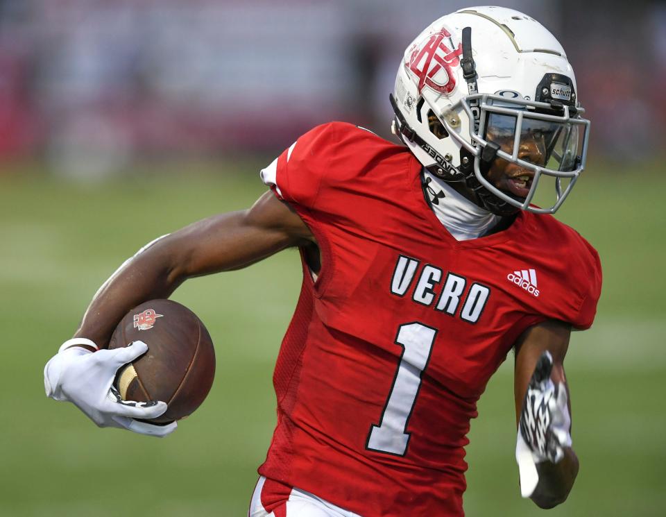 Vero Beach High School's Vandrevius Jacobs  escapes the grip of a South Fork defender as the Vero Beach High School Fighting Indians take on the South Fork Bulldogs on Friday, Aug. 26, 2022, at Billy Livings Field at the Citrus Bow in Vero Beach. Vero Beach won 54-6.  