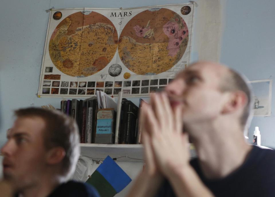 �A vintage map of Mars hangs on the wall at the Mars Desert Research Station (MDRS) outside Hanksville in the Utah desert March 2, 2013. The MDRS aims to investigate the possibility of a human exploration of Mars and uses the Utah desert's Mars-like terrain to simulate working conditions on the red planet. Scientists, students and enthusiasts work together developing field tactics and studying the terrain. All outdoor exploration is done wearing simulated spacesuits and carrying air supply packs and crews live together in a small communication base with limited amounts of electricity, food, oxygen and water. Everything needed to survive must be produced, fixed and replaced on site. Picture taken March 2, 2013. REUTERS/Jim Urquhart