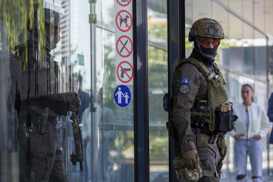 Kosovo police members of Special Intervention Unit secure the area around the court during a session for the arrested Serbian gunman after the Kosovo shootout in capital Pristina, on Tuesday, Sep.26, 2023. Sunday's clash was one of the worst since Kosovo declared independence from Serbia in 2008. It came as the European Union and the U.S. are trying to mediate and finalize years long talks on normalizing ties between the two Balkan states. (AP Photo/Visar Kryeziu)