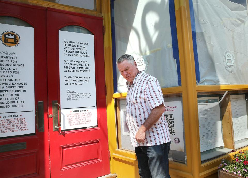 Portsmouth Brewery co-owner Peter Egelston on Monday, July 24, 2023 enters the 32-year-old Market Street business, which has been closed temporarily as it recovers from a burst sprinkler pipe that flooded the premises in June.