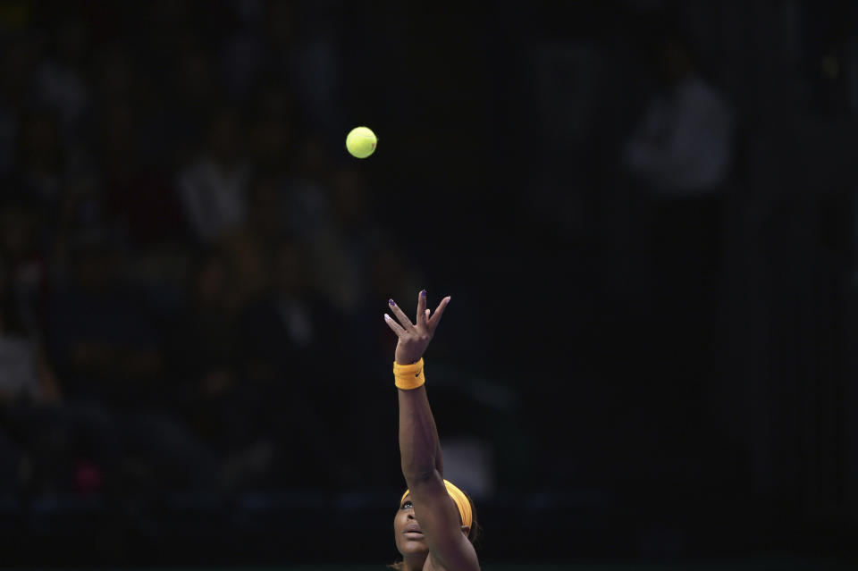 File-This Oct. 22, 2013, file photo shows Serena Williams of the US keeping her eyes the ball as she serves to Angelique Kerber of Germany during their tennis match at the WTA Championship in Istanbul, Turkey. Williams has been voted the AP Female Athlete of the Decade for 2010 to 2019. Williams won 12 of her professional-era record 23 Grand Slam singles titles over the past 10 years. No other woman won more than three in that span. She also tied a record for most consecutive weeks ranked No. 1 and collected a tour-leading 37 titles in all during the decade. Gymnast Simone Biles finished second in the vote by AP member sports editors and AP beat writers. Swimmer Katie Ledecky was third, followed by ski racers Lindsey Vonn and Mikaela Shiffrin.(AP Photo/File)