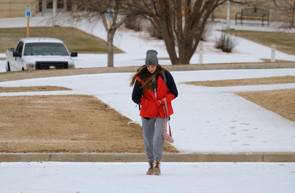 A student walks across the UCO campus as wintery weather hit the Edmond and other parts of the Oklahoma City metro Monday morning, January 30, 2023.