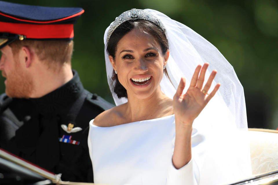 Meghan Markle waves to the crowd.