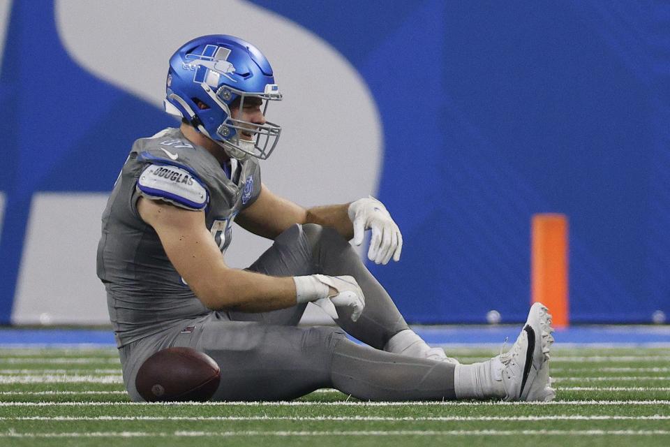 Sam LaPorta of the Detroit Lions lays on the field with an injury during the first half against the Minnesota Vikings at Ford Field on Jan. 7, 2024, in Detroit.