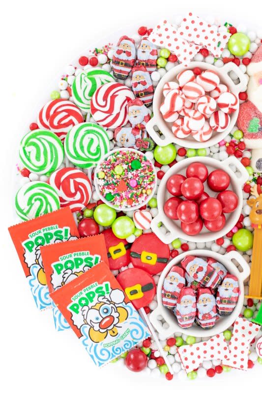 <p>Cutefetti</p><p>To be a kid in a candy shop again is just what this candy board was inspired by! No one could refuse to enjoy something from this Christmas and Santa candy board. </p><p><strong>Get the recipe: <a href="https://cutefetti.com/santa-candy-charcuterie-board/" rel="nofollow noopener" target="_blank" data-ylk="slk:Santa Candy Charcuterie Board;elm:context_link;itc:0;sec:content-canvas" class="link ">Santa Candy Charcuterie Board</a></strong></p>