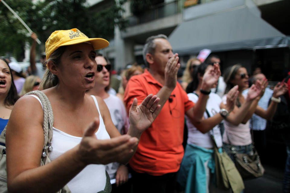 Greek municipal workers protest against the new austerity measures outside the Ministry of Finance, in central Athens, on Wednesday, Sept 12, 2012. A fresh wave of anti-austerity strikes hit Greece Wednesday as the leaders of the governing coalition struggled to finalize further spending cuts for the coming two years — without which the country will lose its vital rescue loans.(AP Photo/Petros Giannakouris)