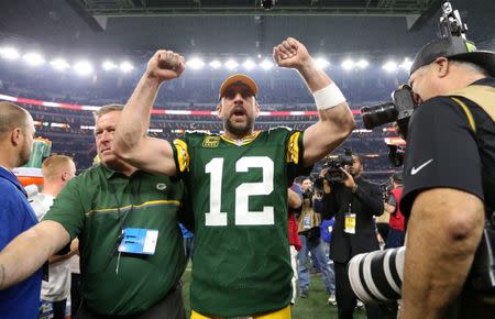 Jan 15, 2017; Arlington, TX, USA; Green Bay Packers quarterback Aaron Rodgers (12) celebrate after beating the Dallas Cowboys in the NFC Divisional playoff game at AT&T Stadium. Mandatory Credit: Matthew Emmons-USA TODAY Sports