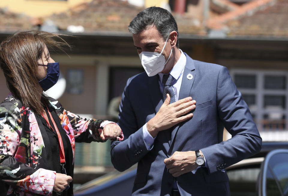 Spain's Prime Minister Pedro Sanchez arrives for an EU summit at the Alfandega do Porto Congress Center in Porto, Portugal, Friday, May 7, 2021. European Union leaders met for a summit in Portugal on Friday, sending a signal they see the threat from COVID-19 on their continent as waning amid a quickening vaccine rollout. Their talks hope to repair some of the damage the coronavirus has caused in the bloc, in such areas as welfare and employment. (Jose Coelho, Pool via AP)