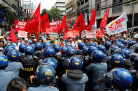 <p>Anti-riot police officers block protesters trying to march towards the U.S. Embassy during a rally against President Donald Trump’s visit, in Manila, Philippines, Nov. 10, 2017. (Photo: Erik De Castro/Reuters) </p>