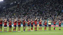 The England players wave to the crowd following their 45-7 win over the United States in their Rugby World Cup Pool C game at Kobe Misaki Stadium in Kobe, Japan, Thursday, Sept. 26, 2019. (AP Photo/Aaron Favila)