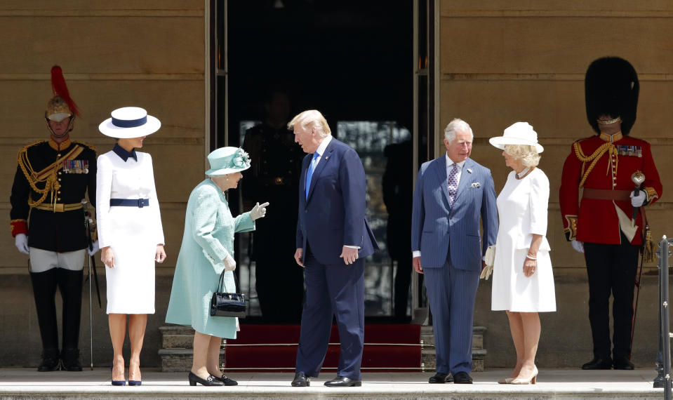 Melania Trump, the Queen, Donald Trump, Prince Charles and Camilla stand on the steps of Buckingham Palace